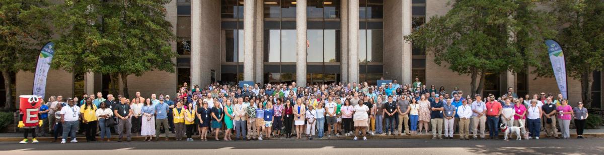 staff of SCDES gathered in front of the building on day 1