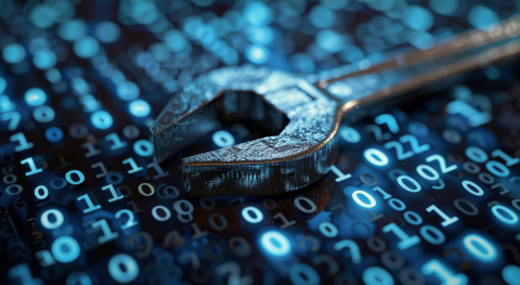 A close-up shot of a wrench lying on a surface of binary code.